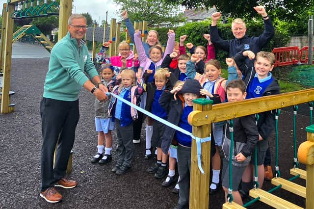 Peter Burton (left), Chair of Grimsargh Parish Council, pictured with teachers and pupils of Grimsargh St. Michael’s