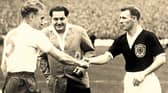 Tommy Docherty, right, shakes hands before a Scotland match. The former Preston North End midfielder was part of Scotland’s 1958 World Cup squad