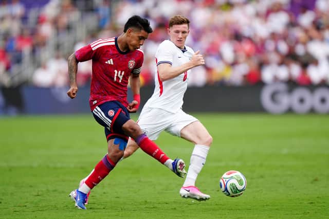 England's Elliot Anderson (right) and Costa Rica's Orlando Galo battle for the ball during the international friendly match at the Inter&Co Stadium in Orlando, Florida on June 10, 2026
