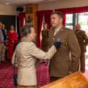 Captain Mark Livingstone receives his General Service Medal from the Princess Royal during her visit to 13 Air Assault Support Regiment Royal Logistic Corps in Colchester