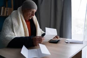 Households worried about rising energy bills are being urged to seek help before winter. Picture posed by model.  