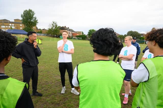 Theo Walcott and Josh Paul offer guidance to young players at Teviot Rangers JFC
