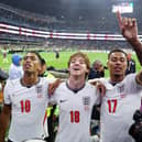 Anthony Gordon Morgan Rogers and Jude Bellingham celebrate after the team's 3-2 victory during the FIFA World Cup 2026 Round of 16 match between Mexico and England