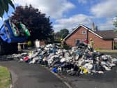 The contents of the bin wagon had to be poured onto Greenway after a fire was spotted.