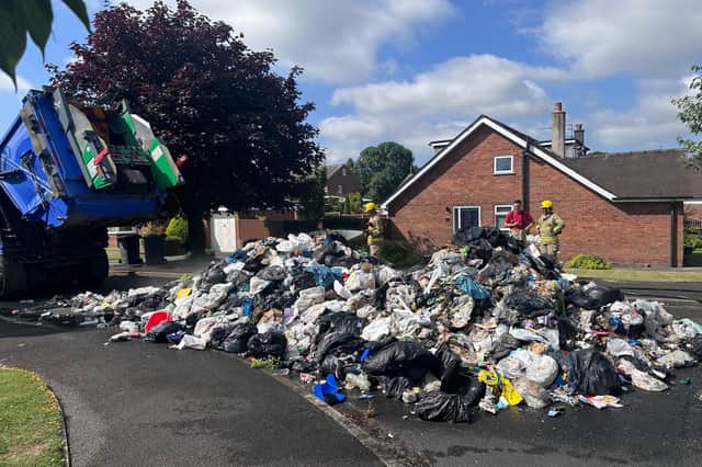The contents of the bin wagon had to be poured onto Greenway after a fire was spotted.