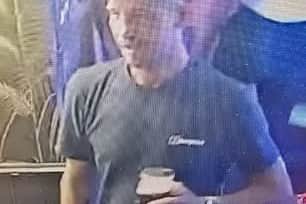 Police have released images of a man they want to speak to into an investigation into criminal damage at the Royal British Legion monument in Accrington.
