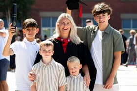 New University of Lancashire graduate Bianca Wright with her four sons on graduate day.