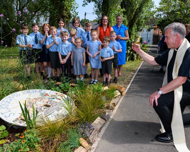 Father Mark blesses the new commemorative garden created at St Joseph's School created to mark 250 years of the Parish of St Joseph's. Photo: Kelvin Lister-Stuttard