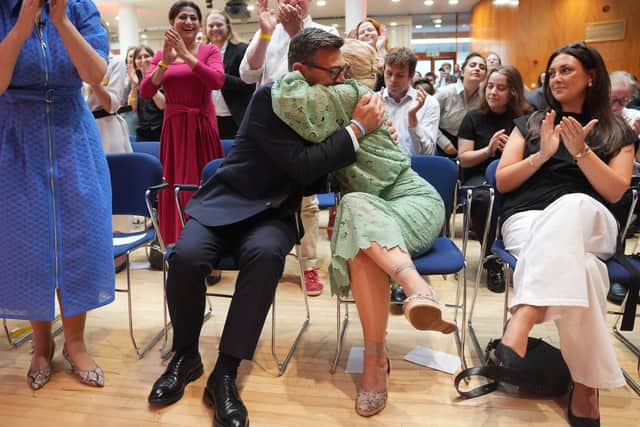 Andy Burnham hugging his wife Marie-France van Heel after being confirmed as the new Labour leader (Yui Mok/PA)