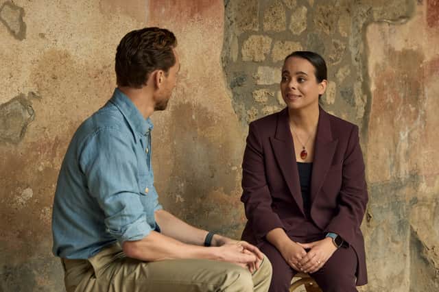 Tom Hiddleston talks with Dr. Sarita Robinson in the house of Julia Felix at Pompeii