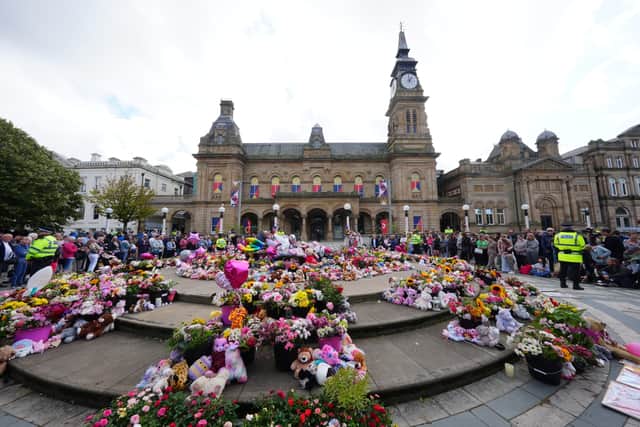 Flowers and tributes outside the Atkinson Art Centre in Southport left for the victims of the attack (PA)