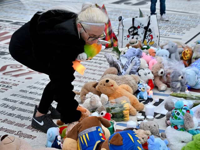 Preston Davey's birth mum Sarah Davey lays teddies on the Comedy Carpet in Blackpool as a vigil was held on the third anniversary of her son's murder