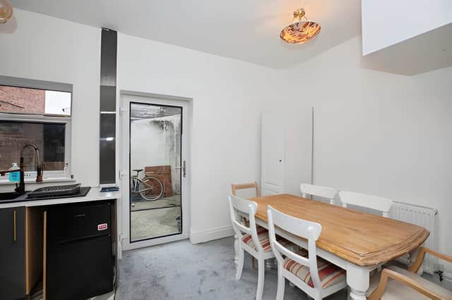 The modern kitchen diner combines fitted units, integrated appliances and space for everyday meals.