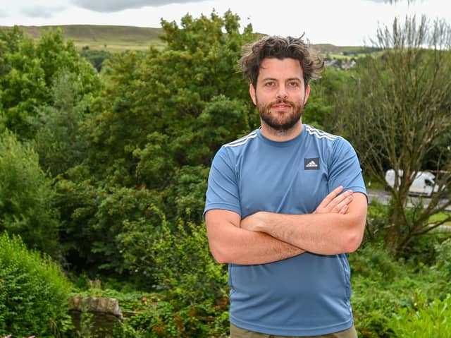 Nathan Hannaway in his garden near Blackburn, which was overrun with Japanese Knotweed.