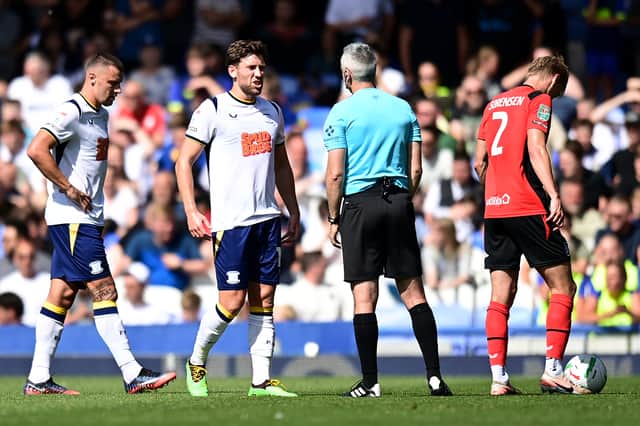 Preston North End's Callum Lang protests to Referee Seb Stockbridge