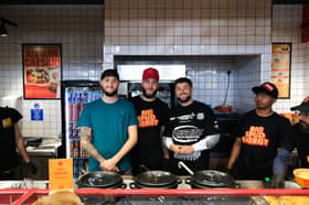 Jacob and Harley Nelson with SpudBros employees inside their new store