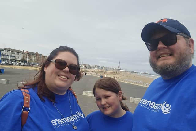 Graham Sims with wife Nikki and daughter Chloe at end of his walk for Rosemere