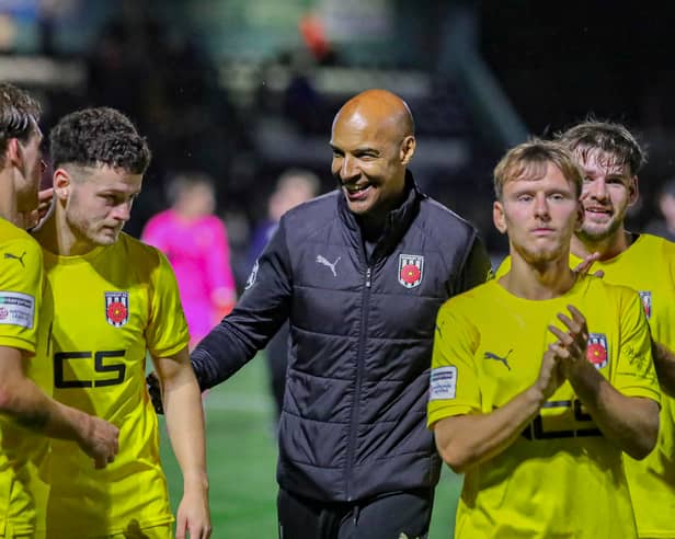 Chorley boss Andy Preece, centre, celebrates with his players at the end of the 2-0 win over Marine