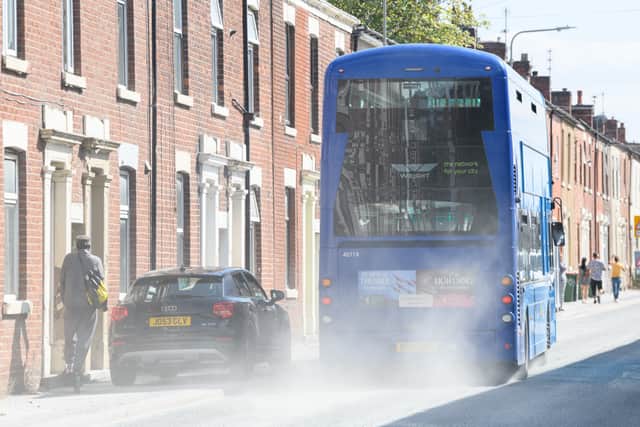 A passing bus creats a dust cload on the recently surface dressed Plungington Road. Photo: Kelvin Lister-Stuttard
