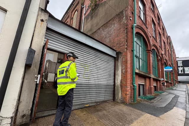 Police at the scene in Union Street, Preston. Credit: Neil Cross
