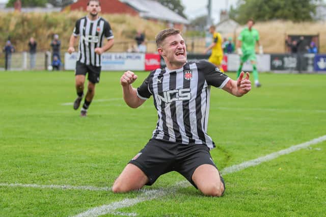 Elliot Taylor celebrates his equaliser against Brackley Town