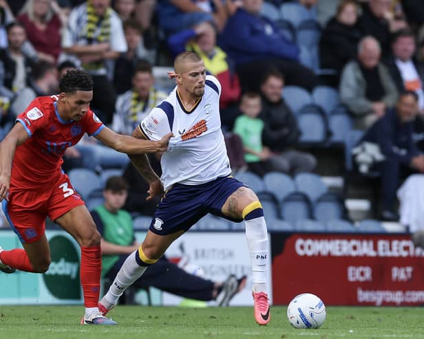 Preston North End's Harry Clarke holds off the challenge from Blackburn Rovers' Kristi Montgomery
