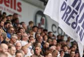 Preston North End fans watch their team in action 