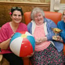 Well-being co-ordinator Tracey Whitaker, left, and Stacey Day from Rise, right, with Patricia Stirrup, 86, a resident at Gillibrand Hall Care Home, Chorley, taking part in a chair-based exercise class which has helped her walk again several months after a fall 