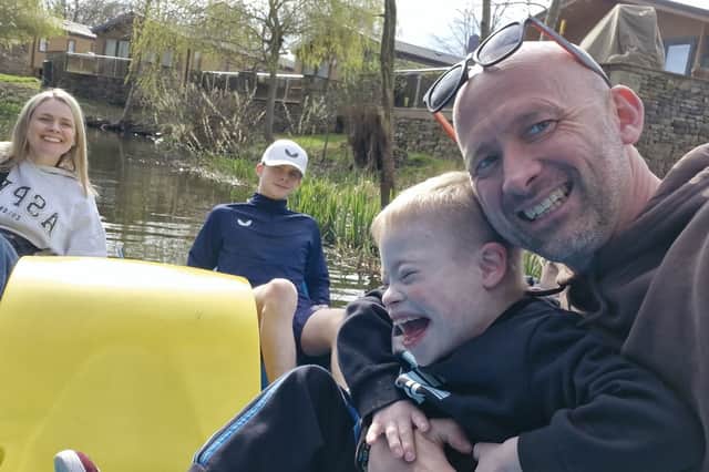 Jacob with dad Andy and his family.