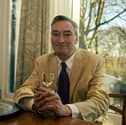 The late Tarquin Scott, pictured in the window of his home, Overleigh, overlooking Avenham Park