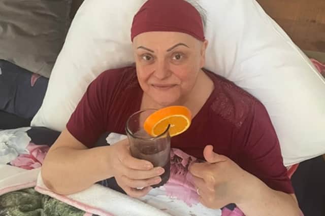 Michelle in hospital undergoing treatment.