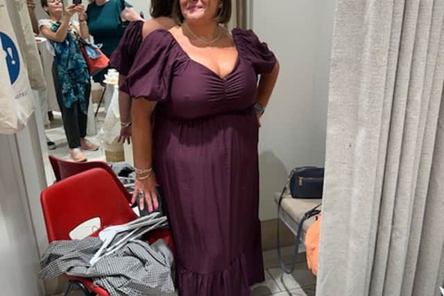 Michelle tries on some of the fashion show outfits.