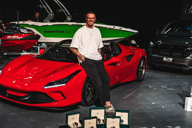 Elite Competitions CEO Alex Beckett with Prize Draw spoils
