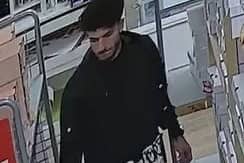 Police want to speak to this man about an attempted burglary in Preston city centre.