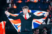 Sam Jones flies the Union Jack in Shanghai after winning gold in Refrigeration and Air Conditioning at the WorldSkills championships
