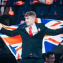 Sam Jones flies the Union Jack in Shanghai after winning gold in Refrigeration and Air Conditioning at the WorldSkills championships