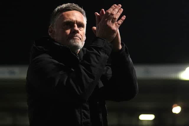Graham Alexander applauds after a game