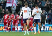 Preston North End's Alfie Devine (left) and Jusef Erabi are left dejected as Millwall players celebrate their opening goal scored by Camiel Neghli.