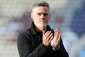 Preston North End manager Graham Alexander applauds the fans at the final whistle against Millwall.