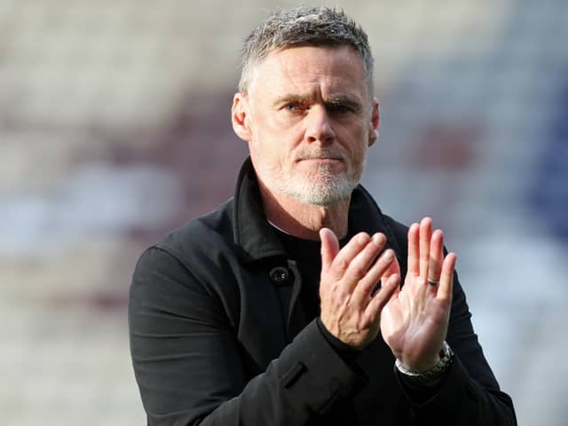Preston North End manager Graham Alexander applauds the fans at the final whistle against Millwall.