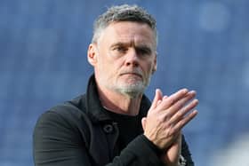 Preston North End manager Graham Alexander applauds the fans at the final whistle