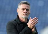 Preston North End manager Graham Alexander applauds the fans at the final whistle
