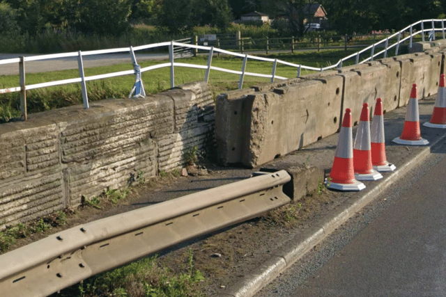 The permanent safety barrier ends before the part of the bridge that is most often struck - meaning emergency concrete blocks have to be put in place to prevent an exposed drop