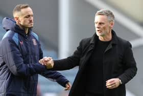 Preston North End manager Graham Alexander consoles Andrija Vukcevic at the final whistle