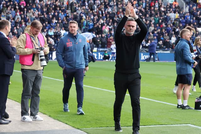 Preston North End manager Graham Alexander applauds the fans as he makes his way to the dugout ahead of kick-off