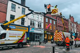 Workers were seen stringing up Preston's Christmas lights