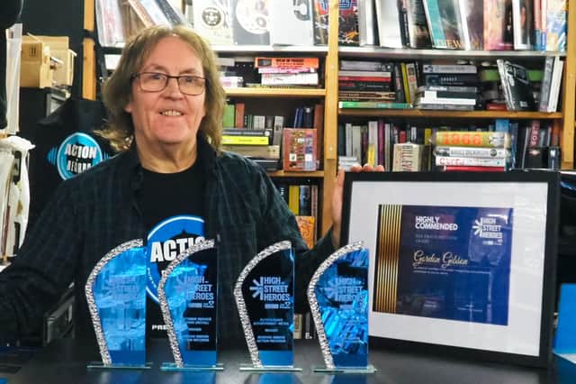 Gordon Gibson with his four trophies and certificate