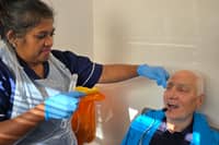 Christopher Howarth having the pill on a thread test with senior research nurse Irene Debiram-Beecham