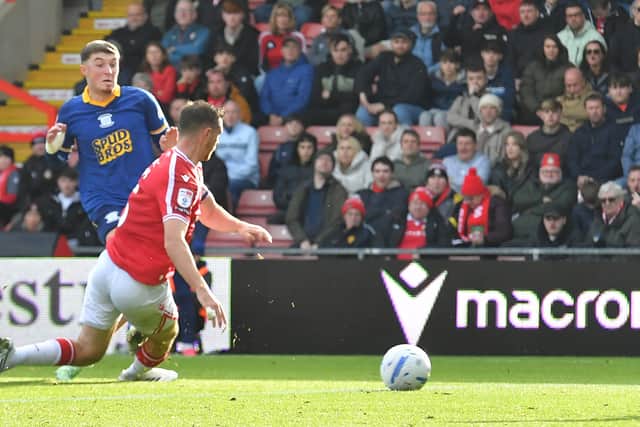 Preston North End's Alfie Devine scores his team’s first goal