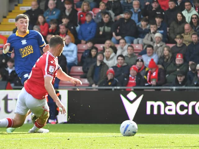 Preston North End's Alfie Devine scores his team’s first goal